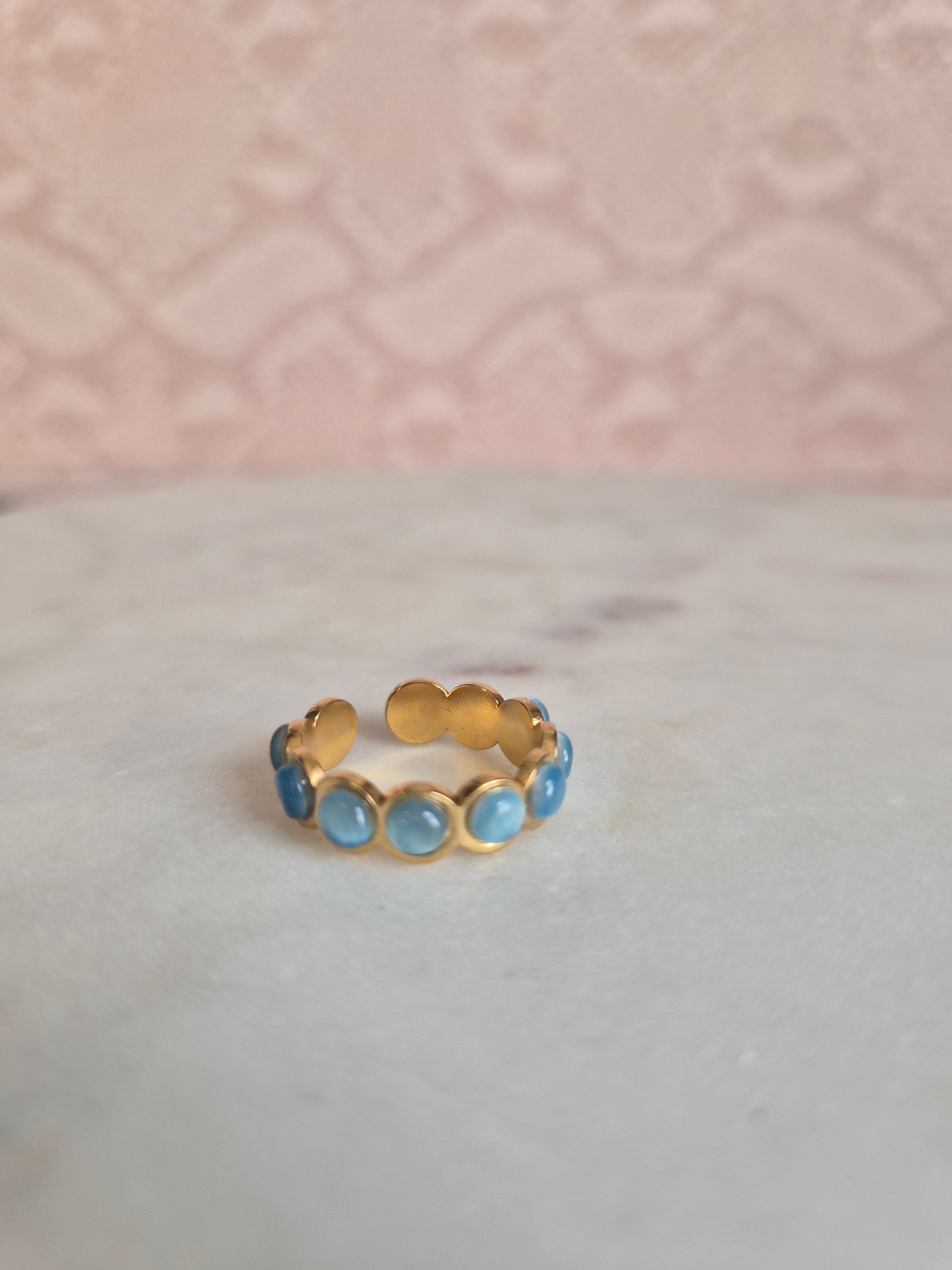 Blue a gold ring